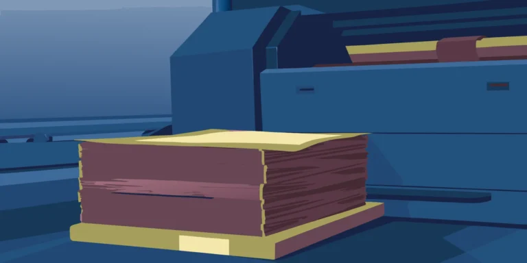 A commercial printer with a stack of quality prints, a guide to finding the right printing company.