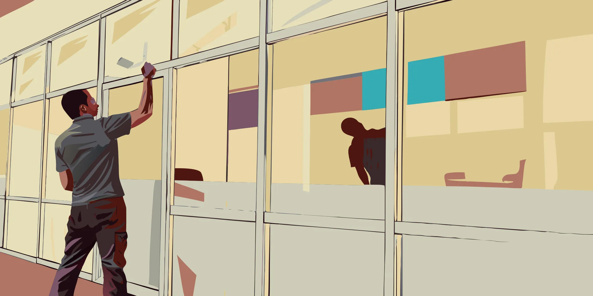 Worker installing custom vinyl window graphics for office branding and privacy.