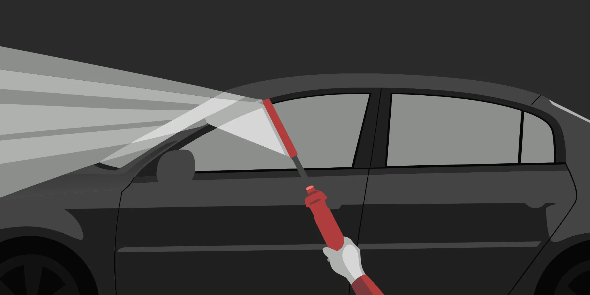 Cleaning a car window before applying window decals for cars.