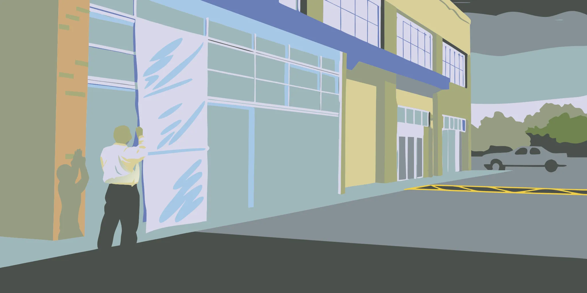 Installer measuring a large banner on a commercial building